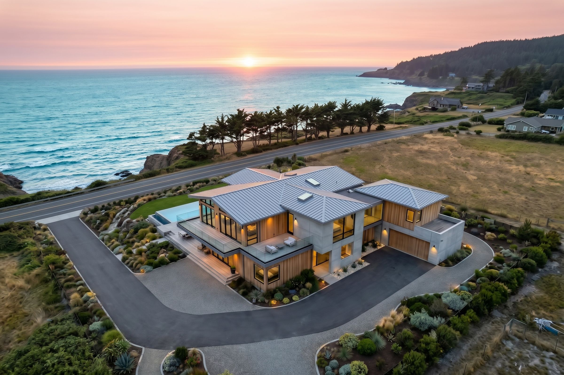 Aerial view of the finished home on the same lot at sunset
